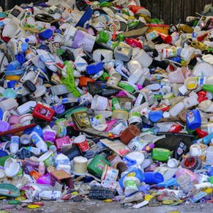 Massive colorful collection of used plastic bottles and containers in a recycling center.